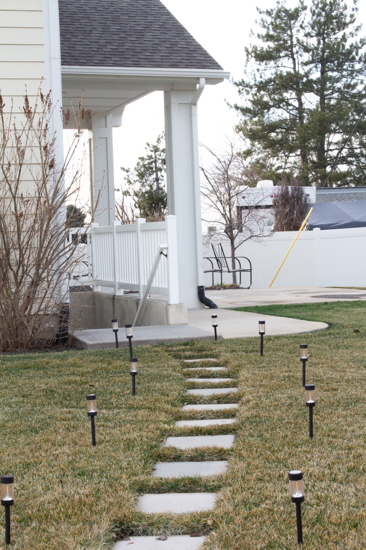 Welcoming lit walkway leading to the Harmony Health & Wellness entrance in Farmington, Utah