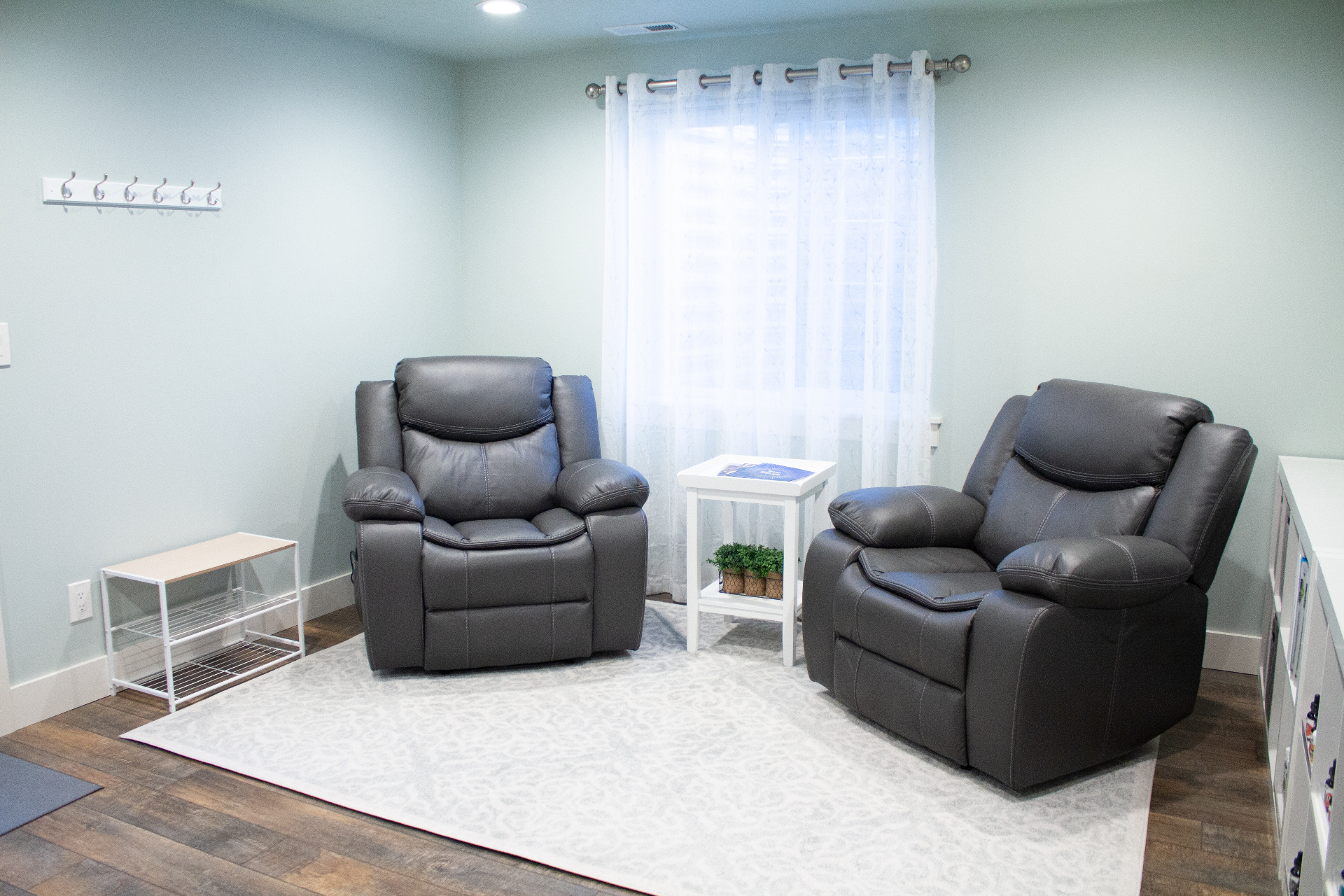 Comfortable waiting room with recliners at Harmony Health & Wellness